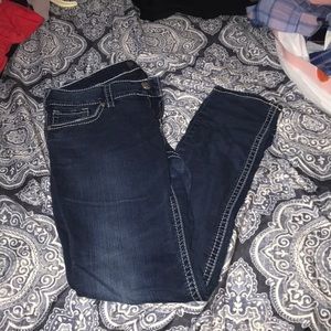Gently used silver skinny jeans